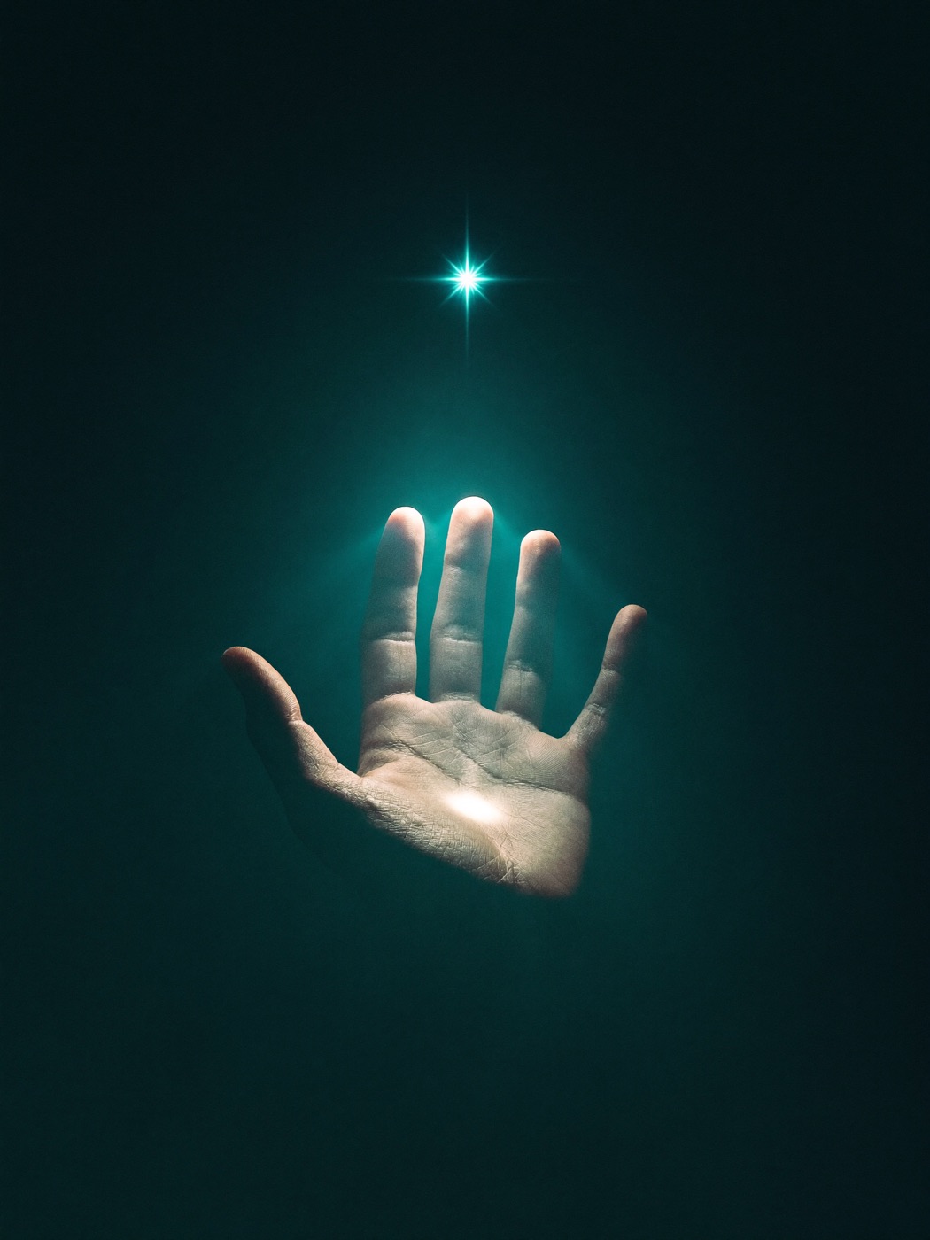 An open hand with a small star of light floating above the palm